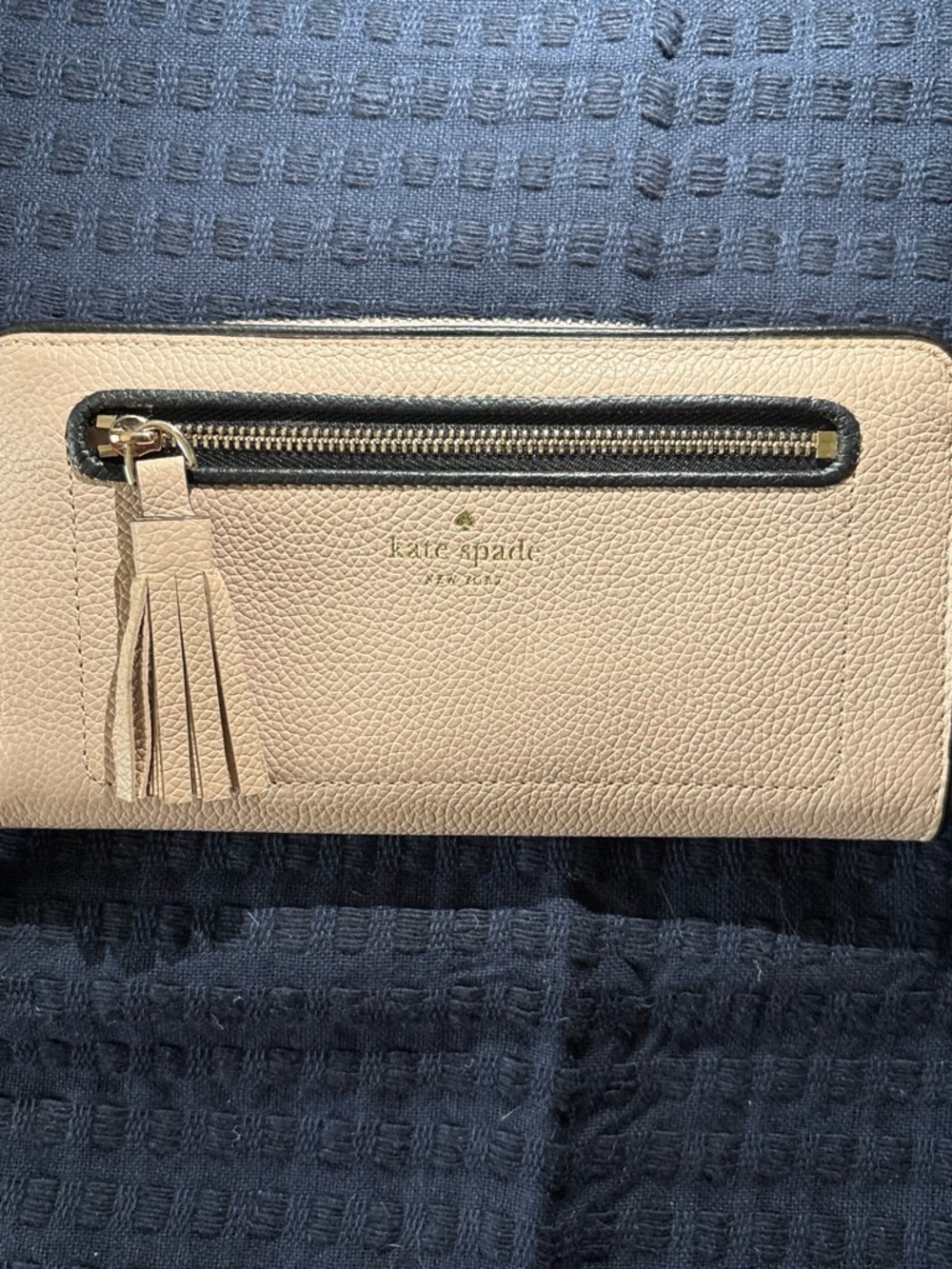 kate spade beige pebbled leather tassel zip wallet